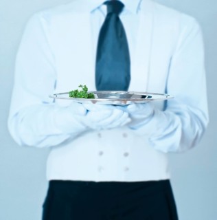 Waiter holding a silver tray