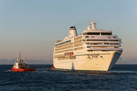 Seven Seas Mariner' cruise ship of Regent Seven Seas Cruises is towed out to sea