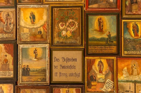 Old votive offerings in the cloister around the Shrine of Our Lady of Altotting
