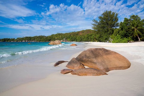 Sandy beach with the typical rock formations of the Seychelles