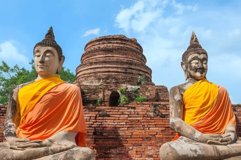 Buddha statues next to the central stupa
