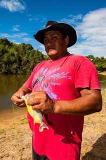 Man holding a piranha