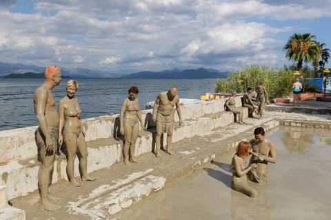 People taking a mud bath