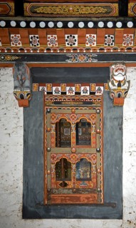 Window in typical Bhutanese style in the Trashi Chhoe Dzong monastic fortress