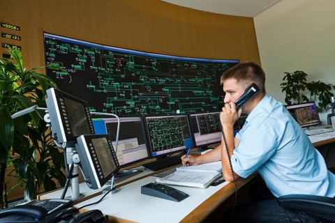 Engineer sitting at his work station in the Transmission Control Center