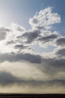 A sand storm over the Mesquite Flat Sand Dunes and the Panamint Range in the evening