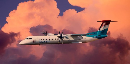 Luxair De Havilland Canada DHC-8-402Q Dash 8 in flight during a thunderstorm