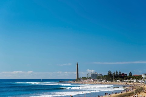 Beach of Maspalomas with the lighthouse and hotels