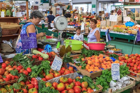 Market stall with fruit and vegetables in the market hall of Sanremo