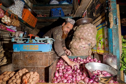 Man selling potatoes and onions at Crawfort Market