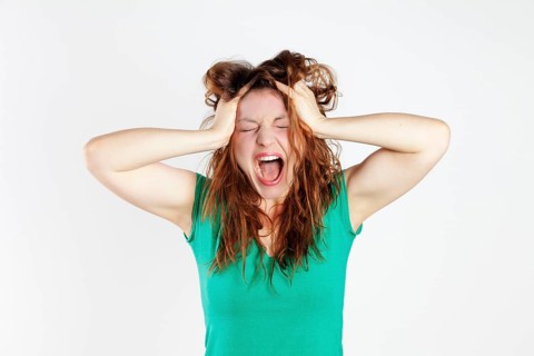 Desperate young woman screaming