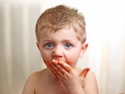 Toddler with a sauce-smeared face