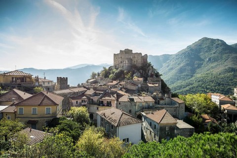 Medieval village with a castle in the mountains
