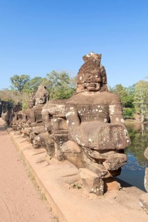 Asura statues aligned at the south gate causeway of Angkor Thom