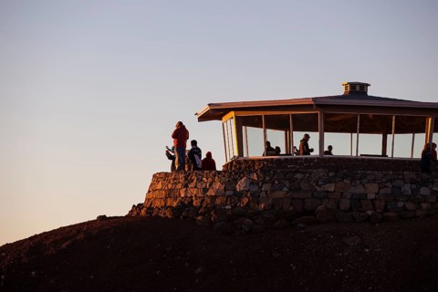 Tourists awaiting the sunrise on the summit of the Haleakala volcano