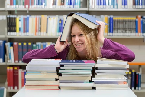 Student studying in the departmental library of the University of Hohenheim in Schloss Hohenheim Palace