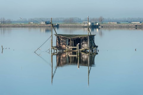 Dilapidated fishing hut in a lagoon
