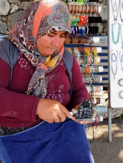 Woman carving a stone
