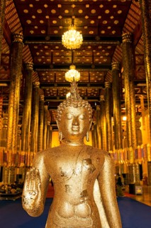 Gilded Buddha at the entrance of Wat Chedi Luang Temple