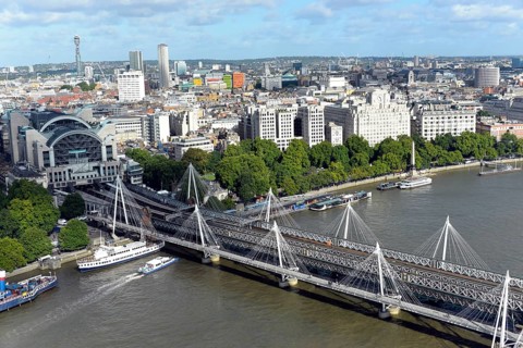 Hungerford Bridge over the River Thames with Charing Cross Station