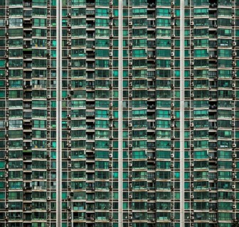 Facade of a high-rise building with balconies and air conditioning units