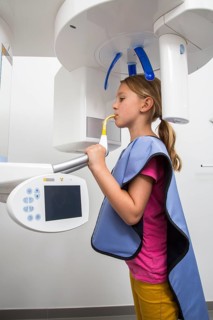 Girl receiving an x-ray of her teeth