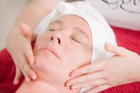 Woman receiving a face massage