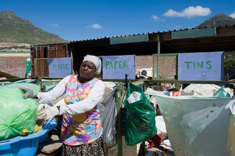 Woman working at a collecting point for recycling
