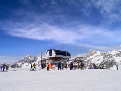 Skiers at the chairlift station