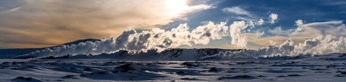 Geyser in a snow-covered landscape