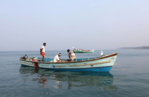 Local mussel fishermen in their boat off the coast