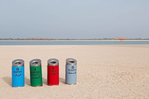 Rubbish bins for sorting waste on the beach at Corniche Road