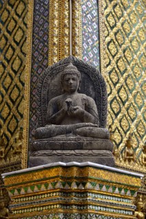 Buddha statue in front of the Mondop