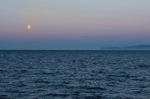 Moon setting over the Bering Strait