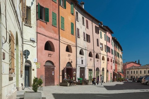 Historic row of houses with portico on the first floor