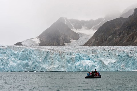 Tourists and guides in an inflatable boat