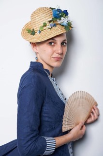 Young woman with hat and fan