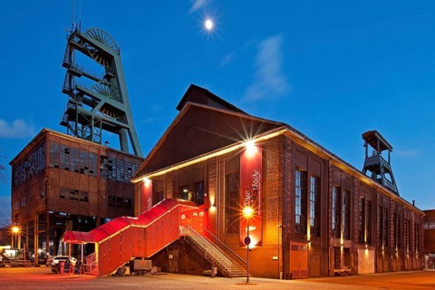 Zeche Ewald colliery with the Revuepalast Ruhr at dusk