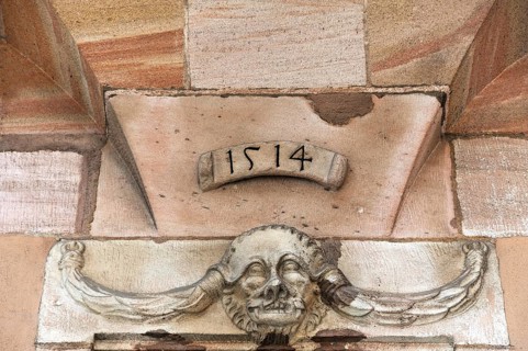 Grotesque with braids on a doorway from 1514