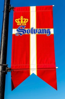 Flag of Denmark hanging on a lamppost in Solvang