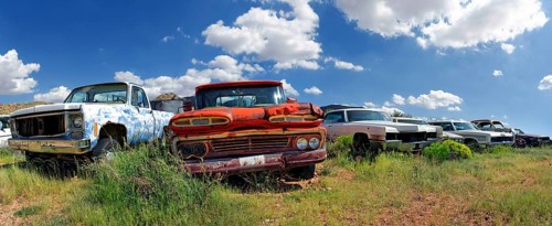 Junk yard with old American cars