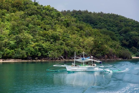 Traditional outrigger boat on the sea