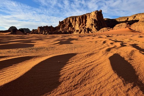 Rock towers and sand dunes at Tamezguida