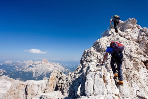Mountain climbers climbing on the Via Ferrata Marino Bianchi climbing route on Monte Cristallo