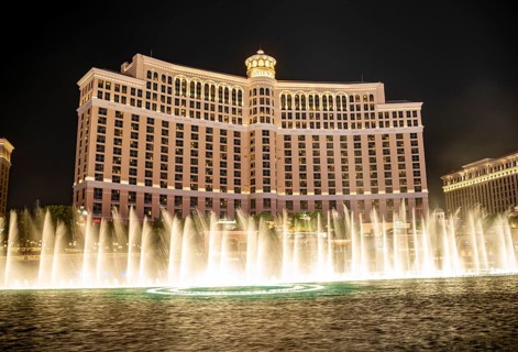 Illuminated fountain in front of the Bellagio Hotel at night
