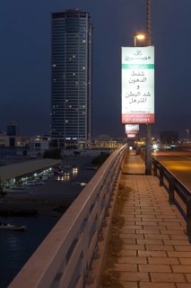 Market halls and skyscraper at dusk