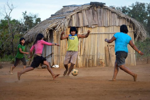 Youngers of the indigenous Xavante people playing football
