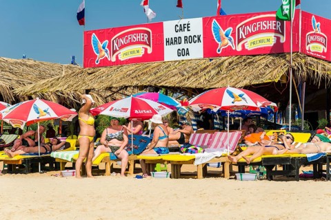 Tourists on the beach in front of Cafe Hard Rock Goa