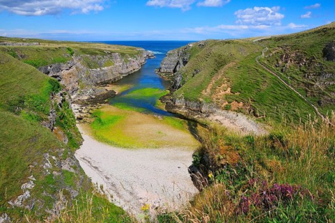 Sea inlet with a trail to a viewpoint at Smoo Cave