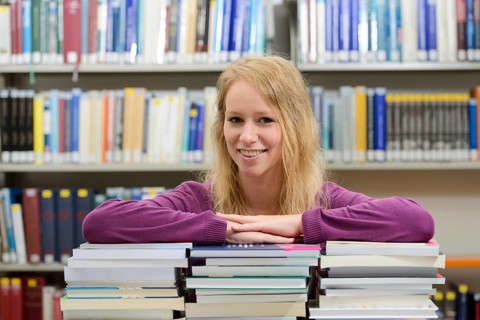 Student studying in the departmental library of the University of Hohenheim in Schloss Hohenheim Palace